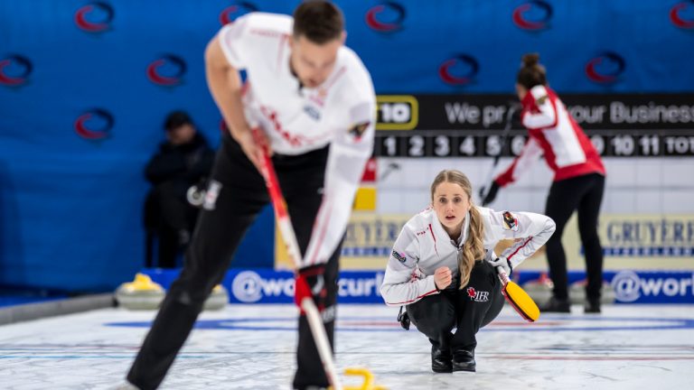 Canada's Jocelyn Peterman and Brett Gallant, left, in action during the Round Robin game between England and Canada at the World Mixed Doubles Curling Championship 2022, at the Sous-Moulin Sports Centre, in Geneva, Switzerland, Wednesday, April 27, 2022. THE CANADIAN PRESS/AP, Keystone - Martial Trezzini