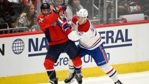 Montreal Canadiens left wing Juraj Slafkovský (20) hits Washington Capitals defenseman John Carlson (74) in the third period of Game 2 of a first-round NHL hockey playoff series Wednesday, April 23, 2025, in Washington. (Nick Wass/AP)