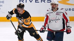 Pittsburgh Penguins' Sidney Crosby (87) and Washington Capitals' Alex Ovechkin (8) skate during the first period of an NHL hockey game in Pittsburgh, Thursday, April 17, 2025. (Gene J. Puskar/AP)