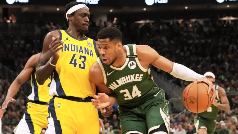 Milwaukee Bucks forward Giannis Antetokounmpo, right, drives against Indiana Pacers forward Pascal Siakam (43) during the first half in Game 3 of an NBA basketball first-round playoff series. (Nam Y. Huh/AP)