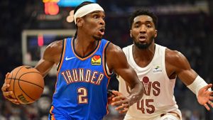 Oklahoma City Thunder guard Shai Gilgeous-Alexander (2) drives against Cleveland Cavaliers guard Donovan Mitchell (45) in the first half of an NBA basketball game. (David Dermer/AP)