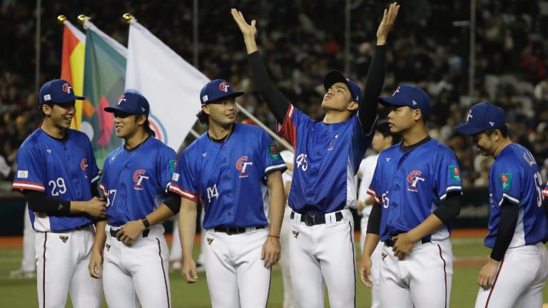 Taiwan players cheer during player introductions before the World Baseball Classic qualifying game between Taiwan win Spain in Taipei, Taiwan, Tuesday, Feb. 25, 2025. (Chiang Ying-ying/AP)