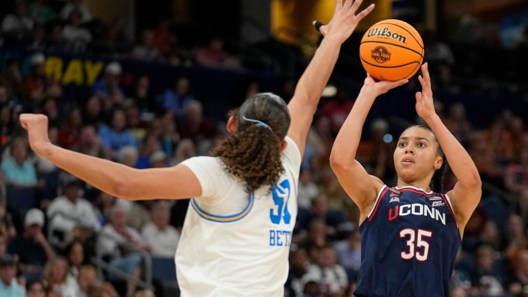 UConn guard Azzi Fudd (35) shoots against UCLA center Lauren Betts (51) during the second half of a national semifinal Final Four game during the women's NCAA college basketball tournament, Friday, April 4, 2025, in Tampa, Fla. (AP Photo/Chris O'Meara)