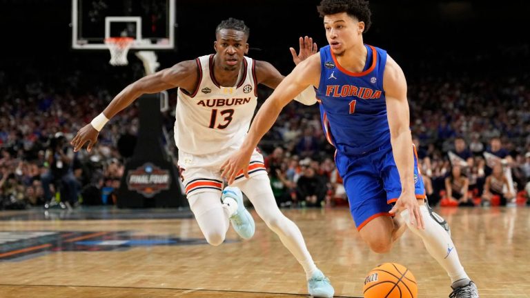 Florida guard Walter Clayton Jr. drives around Auburn guard Miles Kelly during the second half in the national semifinals at the Final Four of the NCAA college basketball tournament. (Brynn Anderson/AP)