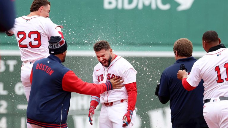 Boston Red Sox's Wilyer Abreu is sprayed with water after hitting a walk off RBI to win the game in the tenth inning during the first game of a doubleheader against the St. Louis Cardinals, Sunday, April 6, 2025, in Boston. (AP/Mark Stockwell)