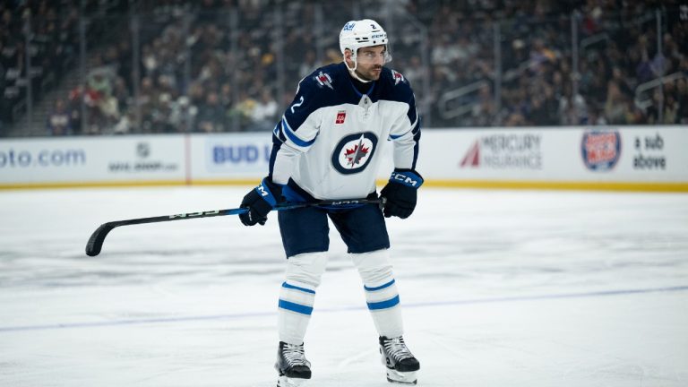 Winnipeg Jets defenseman Dylan DeMelo (2) takes his stance during an NHL hockey game against the Los Angeles Kings, Tuesday, April 1, 2025, in Los Angeles. (Kyusung Gong/AP)