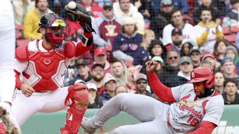 St. Louis Cardinals' Jordan Walker (18) scores at the plate despite an attempted tag by Boston Red Sox catcher Connor Wong in the fourth inning during the first baseball game of a doubleheader, Sunday, April 6, 2025, in Boston. (Mark Stockwell/AP)