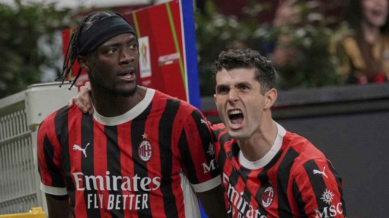 AC Milan's Tammy Abraham , left,celebrates after he scored his side's first goal during an Italian Cup semi final first leg soccer match between AC Milan and Inter Milan at the San Siro stadium. (Antonio Calanni/AP)