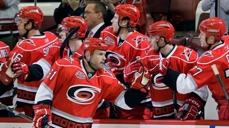 Carolina Hurricanes' Cory Stillman (61) is congratulated by teammates following his goal against the Florida Panthers during the first period of an NHL hockey game in Raleigh, N.C., Tuesday, March 1, 2011. Carolina won 2-1. (Gerry Broome/AP)