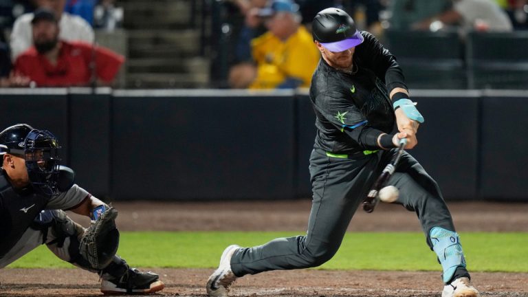 Tampa Bay Rays' Danny Jansen, right, connects for an RBI single off Atlanta Braves pitcher Bryce Elder during the sixth inning of a baseball game Friday, April 11, 2025, in Tampa, Fla. (Chris O'Meara/AP)
