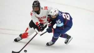 Canada's Renata Fast, left, and United States' Kendall Coyne in action during the gold medal match between Canada and United States at the Women's Ice Hockey Championships in Ceske Budejovice, Czech Republic, Sunday, April 20, 2025. (Petr David Josek/AP)