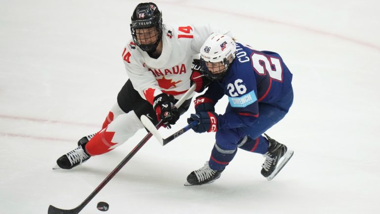 Canada's Renata Fast, left, and United States' Kendall Coyne in action during the gold medal match between Canada and United States at the Women's Ice Hockey Championships in Ceske Budejovice, Czech Republic, Sunday, April 20, 2025. (Petr David Josek/AP)