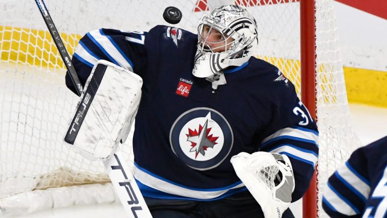 Winnipeg Jets goaltender Connor Hellebuyck (37) makes a save on a St. Louis Blues shot during third period NHL playoff action in Winnipeg, Monday April 21, 2025. (Fred Greenslade/CP)