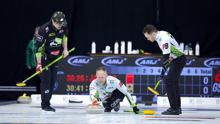 Brad Jacobs (centre) throws a rock during AMJ Players' Championship action on April 9, 2025, in Toronto. (Anil Mungal/GSOC)