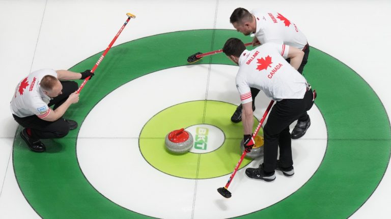 Canada's Ben Hebert and Brett Gallant usher a stone from Marc Kennedy towards the button as skip Brad Jacobs looks on during their country's session against Sweden at the World Men's Curling Championship in Moose Jaw, Sask. on Tuesday April 1, 2025. (Chris Young/CP)