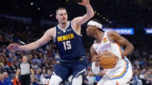 Oklahoma City Thunder guard Shai Gilgeous-Alexander, right, drives against Denver Nuggets centre Nikola Jokic (15) during the first half of an NBA basketball game Monday, March 10, 2025, in Oklahoma City. (Nate Billings/AP)