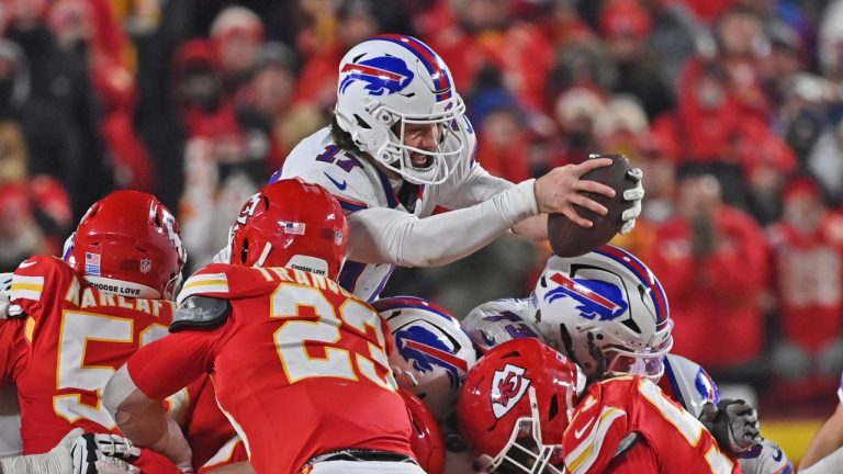 Buffalo Bills quarterback Josh Allen (17) dives over the line of scrimmage for a first down during the AFC Championship NFL football game against the Kansas City Chiefs Sunday, Jan. 26, 2025, in Kansas City, Mo. (Peter Aiken/AP)