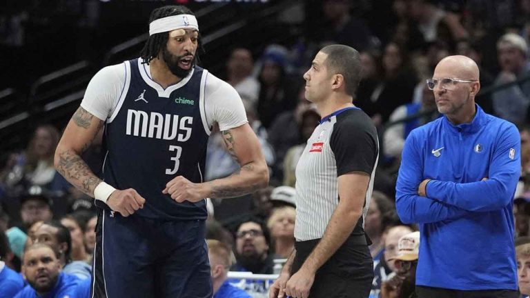 Dallas Mavericks forward Anthony Davis (3) questions a call by referee Mousa Dagher, center, as head coach Jason Kidd looks on during the second half of an NBA basketball game against the Atlanta Hawks. (LM Otero/AP)
