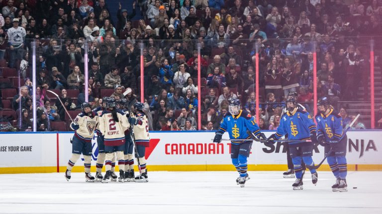 Montreal Victoire's Marie-Philip Poulin, left, celebrates her goal with teammates as the Toronto Sceptres skate back to the bench during second period PWHL hockey action in Vancouver, on Wednesday, January 8, 2025. (Ethan Cairns/CP)