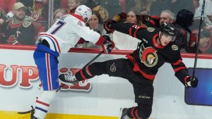 Montreal Canadiens Jayden Struble (47) collides with Ottawa Senators Shane Pinto (12) during first period NHL action in Ottawa., Friday April 11, 2025. (Adrian Wyld/CP)
