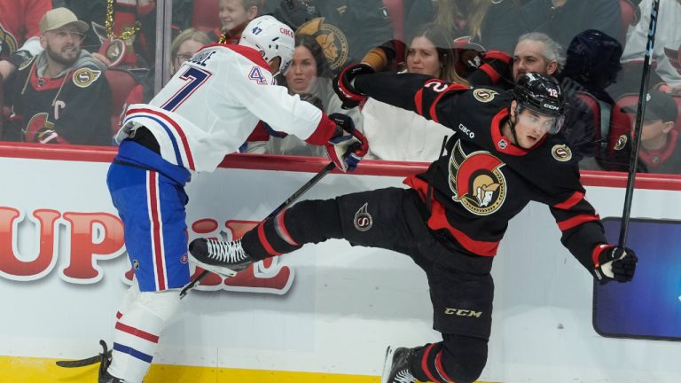 Montreal Canadiens Jayden Struble (47) collides with Ottawa Senators Shane Pinto (12) during first period NHL action in Ottawa., Friday April 11, 2025. (Adrian Wyld/CP)