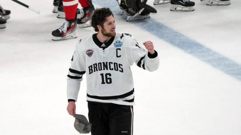 Western Michigan's Tim Washe celebrates after defeating Boston University in the championship game of the NCAA Frozen Four men's college hockey tournament. (Jeff Roberson/AP)