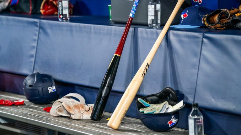A bat with a wider barrel sometimes referred to as a torpedo bat sits next to a normal bat during the first inning of MLB baseball action against the Washington Nationals, in Toronto, Monday, March 31, 2025. (Thomas Skrlj/CP)