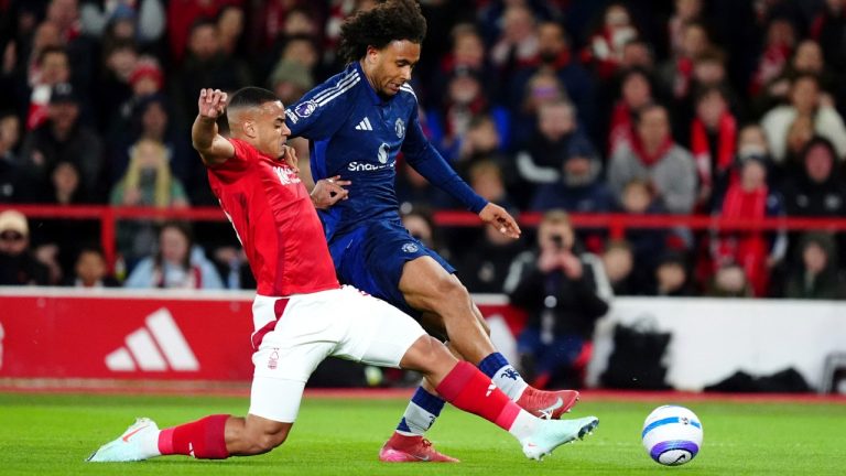 Manchester United's Joshua Zirkzee, right, and Nottingham Forest's Murillo battle for the ball during the English Premier League soccer match between Nottingham Forest and Manchester United at the City Ground, Nottingham, England, Tuesday, April 1, 2025. (Mike Egerton/PA via AP)