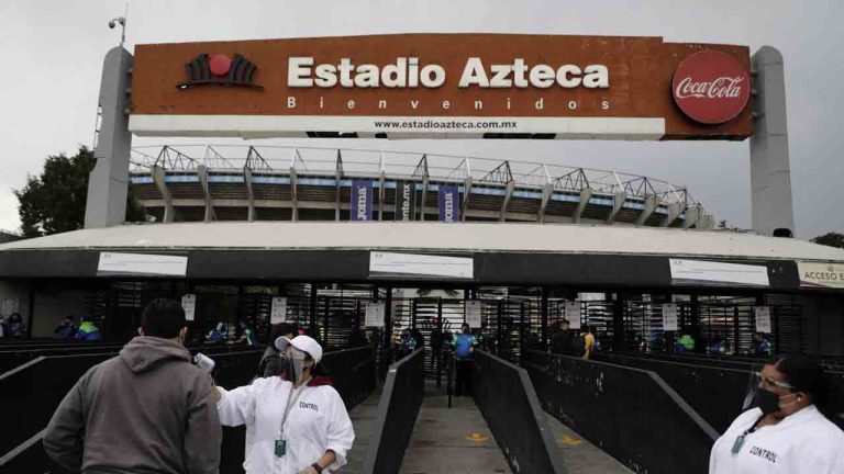 A fan gets his temperature checked as he enters Azteca Stadium before a Mexican soccer league quarterfinal second leg soccer match between Cruz Azul and Toluca in Mexico City, May 15, 2021. (Eduardo Verdugo/AP)