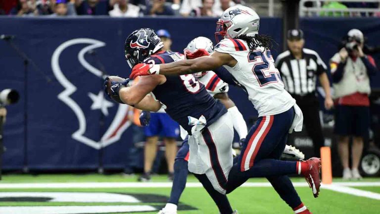 Houston Texans tight end Antony Auclair (83) catches a pass for a touchdown as New England Patriots safety Kyle Dugger (23) defends during the first half of an NFL game on Sunday, Oct. 10, 2021, in Houston. (Justin Rex/AP)