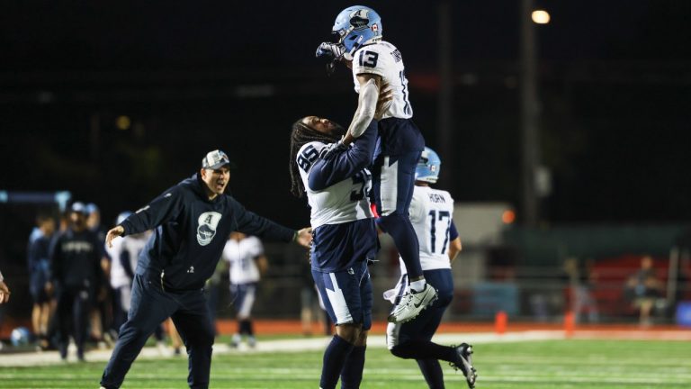 Toronto Argonauts defensive lineman Jordan Williams (95) celebrates a touchdown with wide receiver Calvin Turner (13) during second half pre-season CFL football action against the Hamilton Tiger-Cats in Guelph, Ont. on Friday, May 30, 2025. THE CANADIAN PRESS/Nick Iwanyshyn