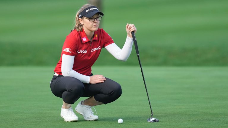 Brooke Henderson, of Canada lines up a putt on the first hole during the first round of the LPGA Ladies Championship golf tournament at the Seowon Valley Country Club in Paju, South Korea, Thursday, Oct. 17, 2024. (Lee Jin-man/AP)