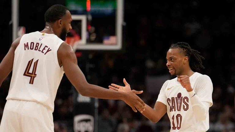 Cleveland Cavaliers guard Darius Garland (10) celebrates with teammate Evan Mobley (4) after hitting a basket in the second half of an NBA basketball game against the Milwaukee Bucks, Friday, Dec. 20, 2024, in Cleveland. (Sue Ogrocki/AP)