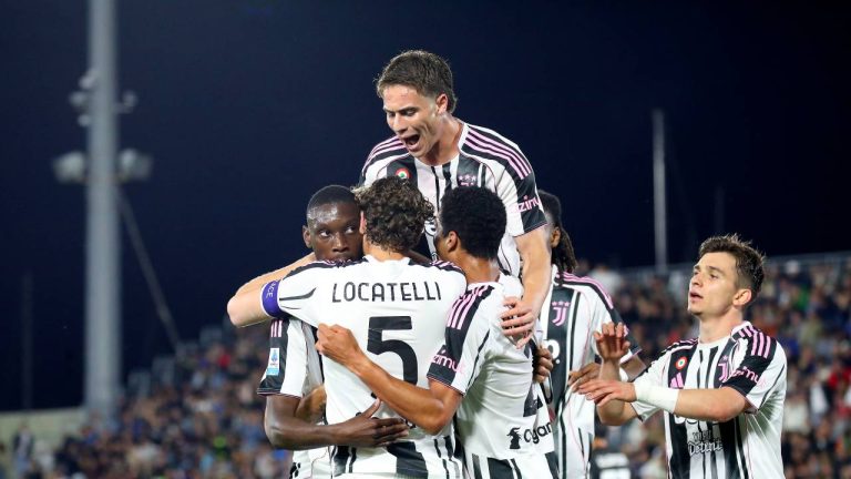 Juventus' Randal Kolo Muani, left, celebrates with team-mates after scoring their side's second goal of the game during the Serie A soccer match between Venezia and Juventus. (Paola Garbuio/LaPresse via AP)