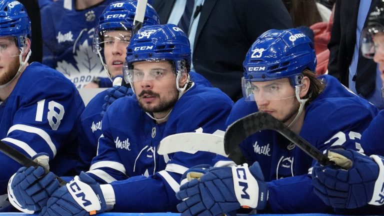 Toronto Maple Leafs centre Auston Matthews (34) and teammate Matthew Knies (23) look on during third period NHL Stanley Cup playoff hockey action against the Florida Panthers, in Toronto, Sunday, May 18, 2025. (Frank Gunn/CP)