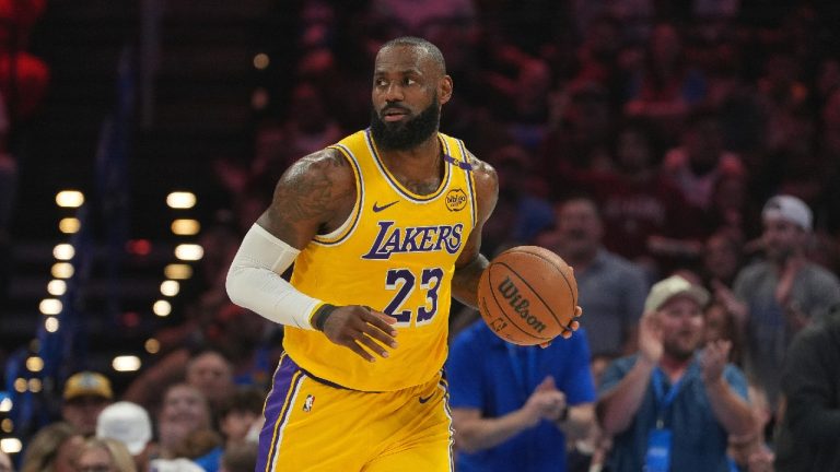 Los Angeles Lakers forward LeBron James pushes down the court during the first half of an NBA basketball game against the Oklahoma City Thunder. (Kyle Phillips/AP)