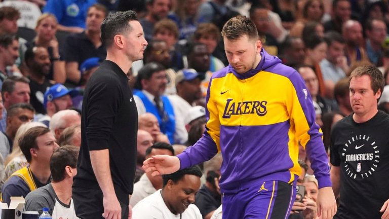 Los Angeles Lakers' Luka Doncic, right, walks past head coach JJ Redick, left, as he checks in to the game in the first half of an NBA basketball game against the Dallas Mavericks in Dallas, Wednesday, April 9, 2025. (LM Otero/AP)
