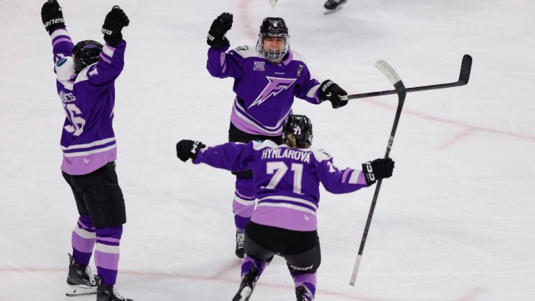 Minnesota Frost forward Katy Knoll (6) celebrates with forward Klára Hymlárová (71) and defenseman Sophie Jaques (16) after scoring during the third overtime period of game 3 of the PWHL final against the Ottawa Charge, Saturday, May 24, 2025, in St. Paul, Minn. (Bailey Hillesheim/AP)