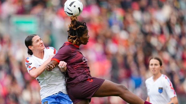 Montreal Roses FC Defender Lucy Cappadona (left) and AFC Toronto forward Esther Okoronkwo (23) jump for the ball during second half Northern Super League soccer action in Toronto on Saturday, April 19, 2025. (Arlyn McAdorey/CP)
