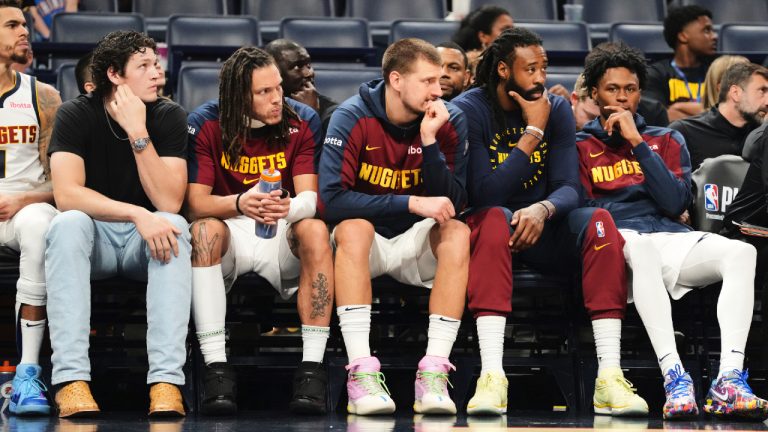 Denver Nuggets' Nikola Jokic, centre, and the rest of the bench watch play against the Oklahoma City Thunder late in the second half of Game 2 in the conference semifinals of the NBA basketball playoffs, Wednesday, May 7, 2025, in Oklahoma City. (Kyle Phillips/AP)