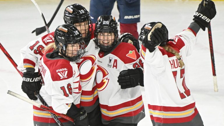Ottawa Charge's Brianne Jenner (19) celebrates with teammates after scoring against the Montreal Victoire during third period PWHL playoff hockey action in Laval, Que. Sunday, May 11, 2025. (Graham Hughes/CP)