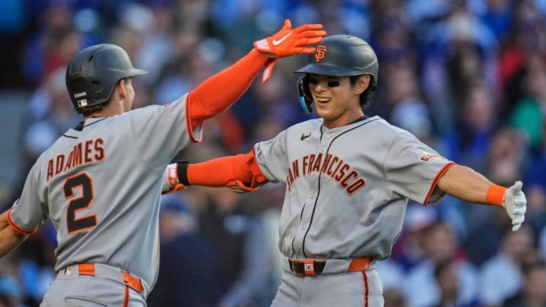 San Francisco Giants' Jung Hoo Lee (51), right, hugs Willy Adames (2) after Lee hit a two-run home run during the third inning of a baseball game against the Chicago Cubs, Tuesday, May 6, 2025, in Chicago. (Erin Hooley/AP)