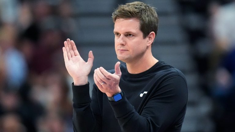 Utah Jazz coach Will Hardy applauds during the second half of the team's NBA basketball game against the Houston Rockets on Thursday, April 11, 2024, in Salt Lake City. (AP Photo/Rick Bowmer)