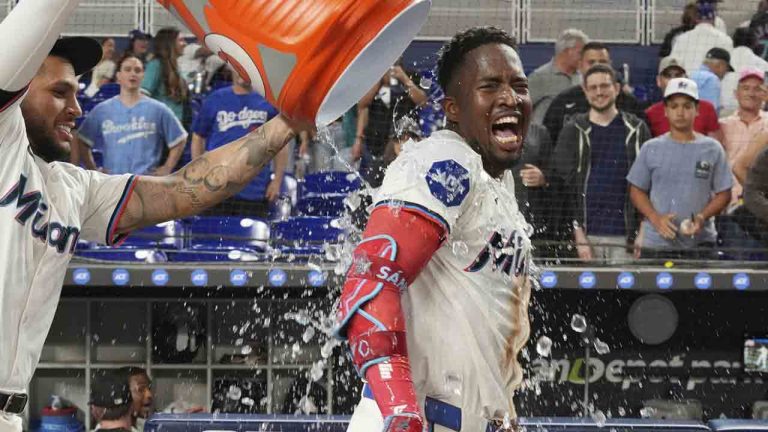 Miami Marlins catcher Agustín Ramírez (50) pours ice water on Jesús Sánchez after he hit a walk off single during the 10 inning of baseball game against the Los Angeles Dodgers, Tuesday, May 6, 2025, in Miami. (Marta Lavandier/AP)