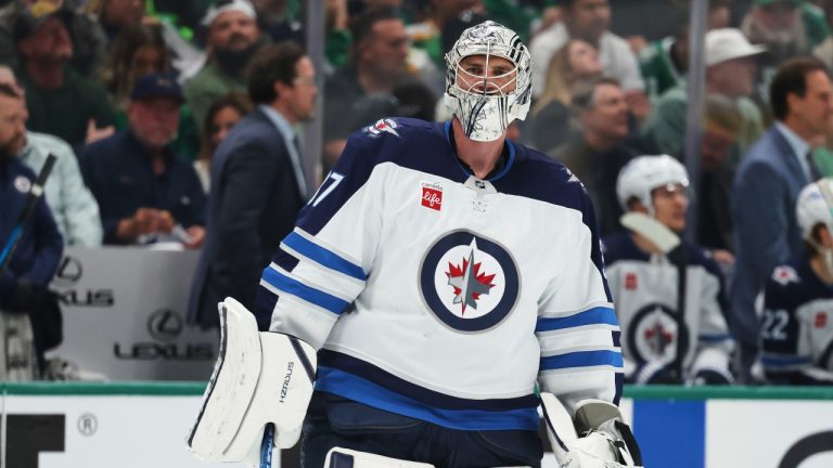 Winnipeg Jets goaltender Connor Hellebuyck skates on the ice during a media time out in the first period of Game 4 of a second-round NHL hockey playoff series aginast the Dallas Stars in Dallas, Tuesday, May 13, 2025. (Gareth Patterson/AP)
