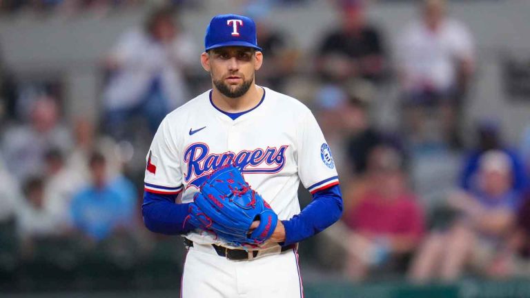 Texas Rangers starting pitcher Nathan Eovaldi looks on before making a pitch to the Toronto Blue Jays during the second inning of a baseball game. (Julio Cortez/AP)