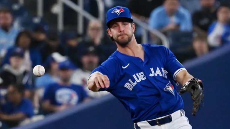 Toronto Blue Jays third baseman Ernie Clement (22) throws to first base to put out Atlanta Braves infielder Nick Allen in sixth inning interleague baseball action in Toronto, Monday, April 14, 2025. (Jon Blacker/CP)