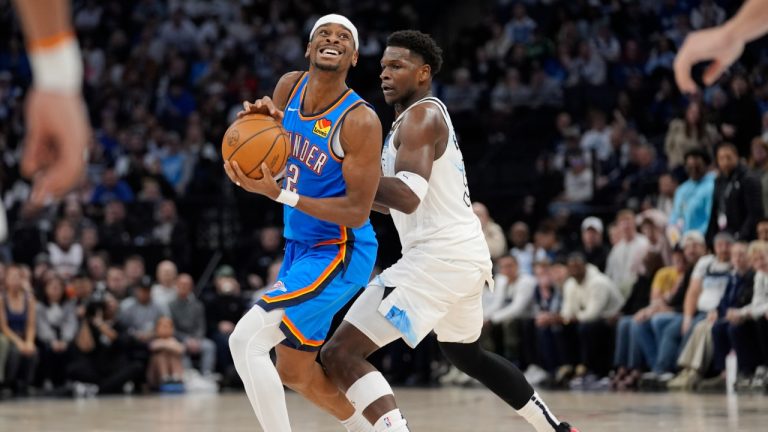 Oklahoma City Thunder guard Shai Gilgeous-Alexander (2) works toward the basket as Minnesota Timberwolves guard Anthony Edwards (5) defends during the second half of an NBA basketball game, Thursday, Feb. 13, 2025, in Minneapolis. (Abbie Parr/AP)