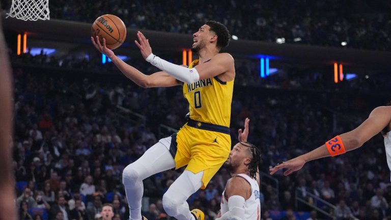 Indiana Pacers guard Tyrese Haliburton (0) goes up for a shot against against the New York Knicks during the first quarter of Game 1 of the NBA basketball Eastern Conference final, Wednesday, May 21, 2025, in New York. (Frank Franklin II/AP)