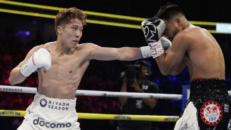 Naoya Inoue hits Ramon Cardenas in a junior featherweight title boxing match. (John Locher/AP)